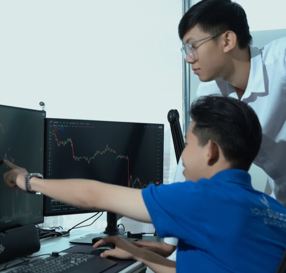 Trading community member at a laptop